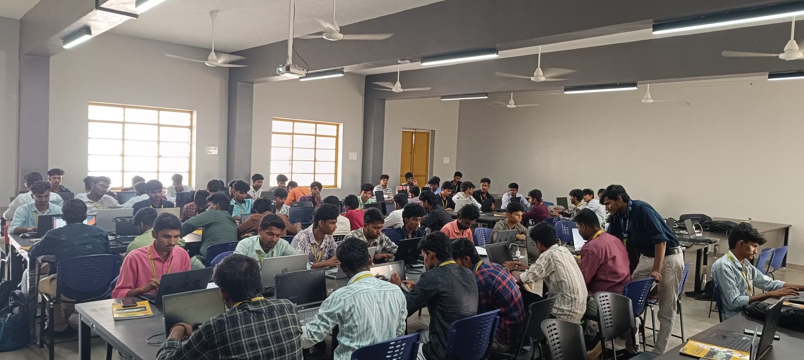 A packed computer lab of students at a GeekBase campus SQL workshop